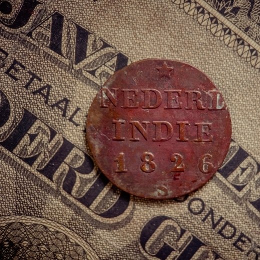 Indian coin over dollar