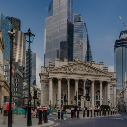 Image shows London bus moving with Royal Bank of England in background