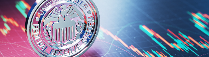 Federal Reserve coin on top of a financial chart abstract