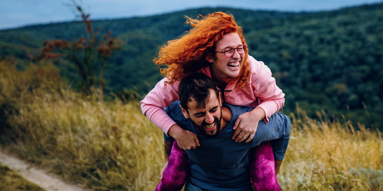 Joint investment account image of a happy couple in a field