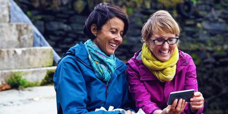 Invest in mutual funds online image of two people at the seaside